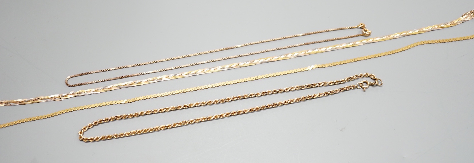 Four assorted modern 9ct chains, including three colour and rope twist, largest 38cm, 25.1 grams.